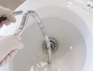 unclogging toilet with plumber s snake